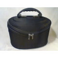 A Large Vintage Ladies "Revlon" Vanity case with satin lined & Zips.In good second hand condition.