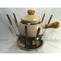 A Almost new/Used complete Enamel "FONDUE set" in Original Box. Ready for U to set out at the party.