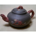 A Vintage Chinese Yixing Pottery Tea pot Signed under and flowers on the side with No damage.