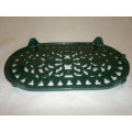 A Vintage cast iron Green Trivet with 4 feet. Ideal to use for serving. Size:150mm Wide x 250mm Long