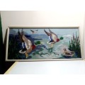 A Collectors Wall Hanging Embroidered Mallard Ducks flying framed picture.