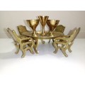 Handcrafted miniature bras dining table set that includes a table and four chairs as well as four g