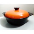 A well-used and in pristine orde, vintage Cookwell orange enameled lidded cast iron cooking pot No8.