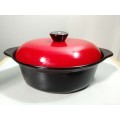 A vintage Cookwell Red lidded cast iron cooking pot