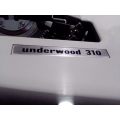 A 1970`s Vintage Underwood 310 Traveling Typewriter in excellent working condition.