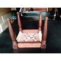 A very old ethnic hand woven seat in good condition for its age. Size 29cm x 31cm.