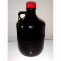 A Very Large Old vintage dark brown Medicine bottle with lid and in good second condition.