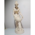 Signed `Artafina`. A Greek lady washing figurine in crushed marble line and Resin. Size: 37cm Tall