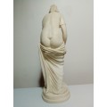 Signed `Artafina`. A Greek lady washing figurine in crushed marble line and Resin. Size: 37cm Tall