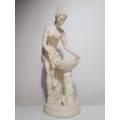Signed `Artafina`. A Greek lady washing figurine in crushed marble line and Resin. Size: 37cm Tall