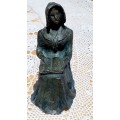 Voortrekker woman with book Sculpture/cast by Nerine Desmond