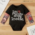 Cutest baby vest for a baby boy tattooed arms