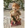 Resin cherub