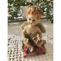 Resin cherub