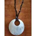 Leather necklace with seashell disk