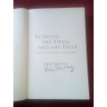 Between the Devil and the Deep by Pieter-Dirk Uys. 1st ed 2005. Signed. S/C. 259 pp.