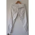 White Calvin Klein Jeans size 28 small with working zips, small zip on each leg condition is good