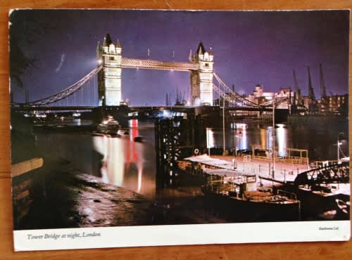 POSTCARD POST CARD UNITED KINGDOM LONDON TOWER BRIDGE at night BARGE BOAT RIVER BUILDINGS CITY.