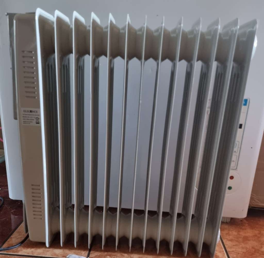 Heaters Elegance 13 Fin Oil Heater (like new in box) was sold for