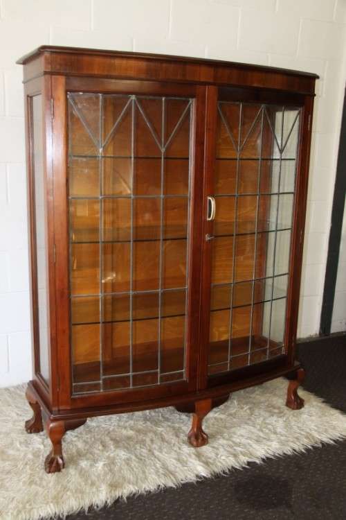 A magnificent imbuia ball and claw display with lead