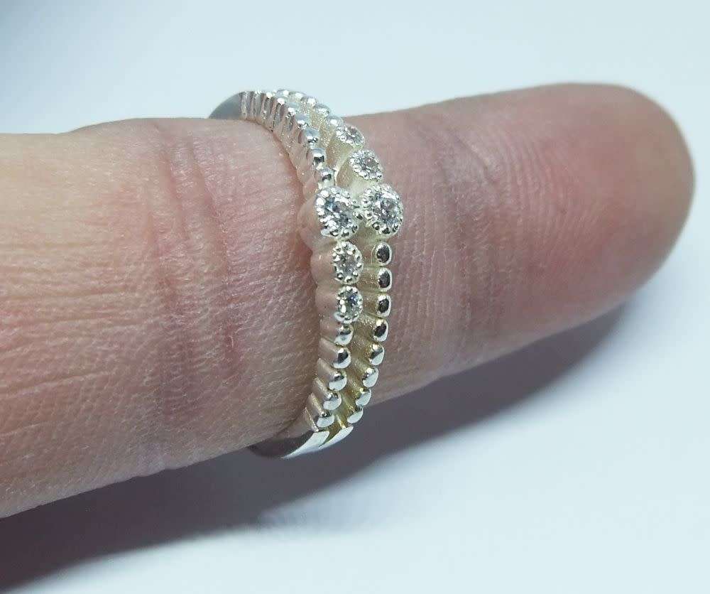 Rings - A genuine sterling silver ring with faceted clear insets ...