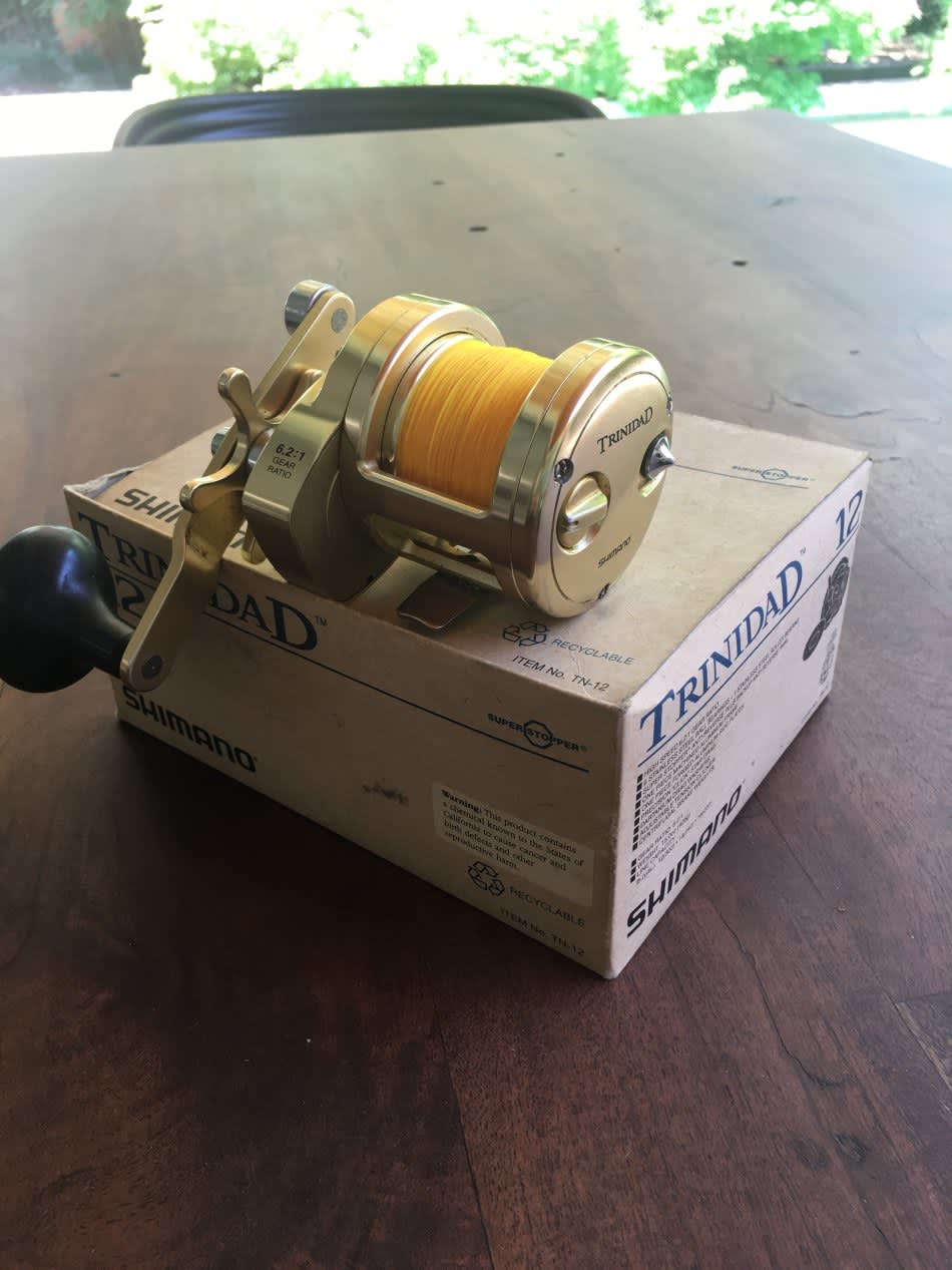 Reels - Shimano Trinidad TN 12 Gold was sold for R2,850.00 on 12