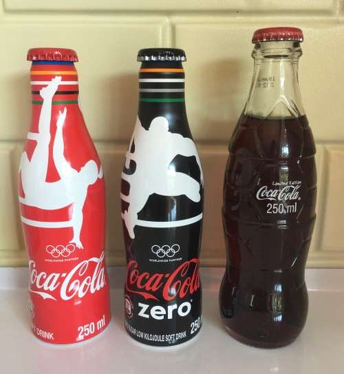 Advertising  Coca Cola Limited Edition Bottles Full and Mint was