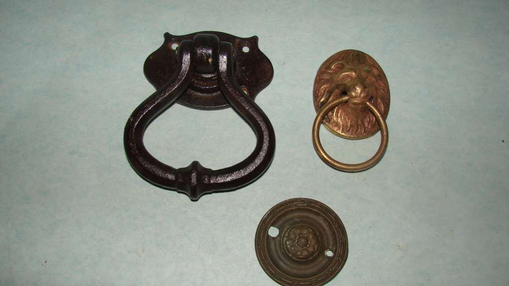 Metal 2 Door Knockers, 1 Cast Iron and 1 Lion Head Brass for sale in