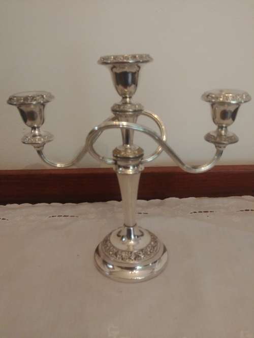 Candlesticks & Candle Snuffers Three Tier Silver Plated Candle Holder. was sold for R115.00 on