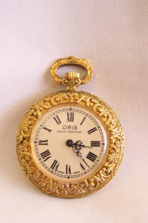 A stunning ornate vintage gold plated 7 Jewel Swiss made Oris ladies pocket watch