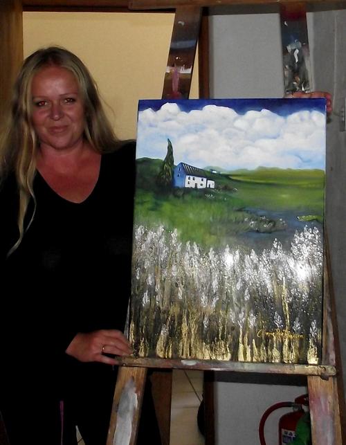 Cherie Roe Dirksen with her painting