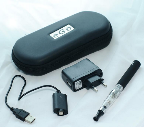 eGo Electronic Cigarette Starter Kit layed out with accessories plus free e liquid