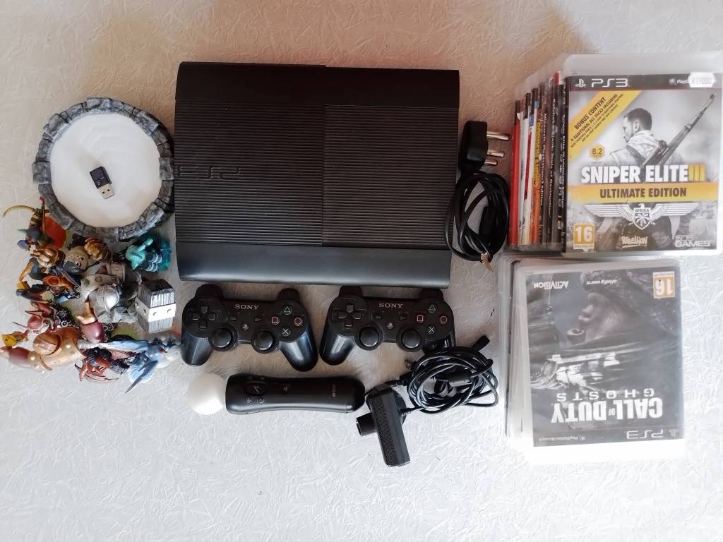 PlayStation Ps3 Super Slim, remotes, games and Skylanders set for
