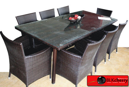 Rattan Dining Table and Chairs set 8 x Rattan Dark Brown Dining Chairs 1 x Rattan Dark Brown Dining Table with glass top  Table Measurements: 1800x1000x720 mm Length x width x height Chair Measurements: 510x480x860 mm Length x width x height