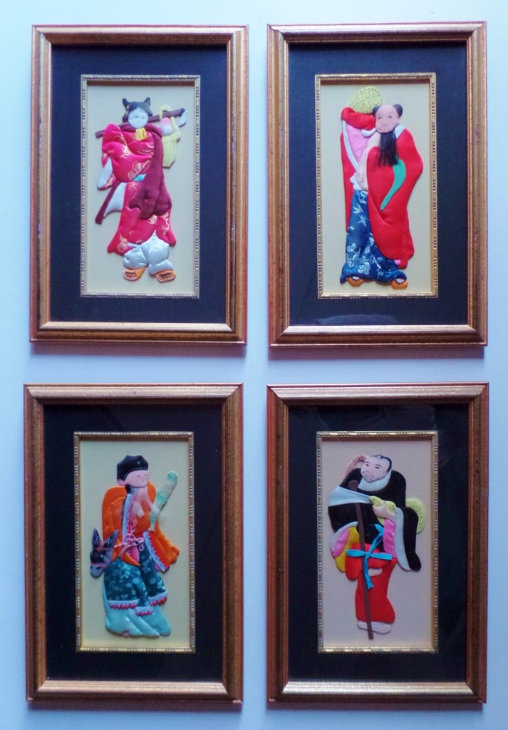 FRAMED SET OF FOUR CHINESE SILK APPLIQUE FIGURES