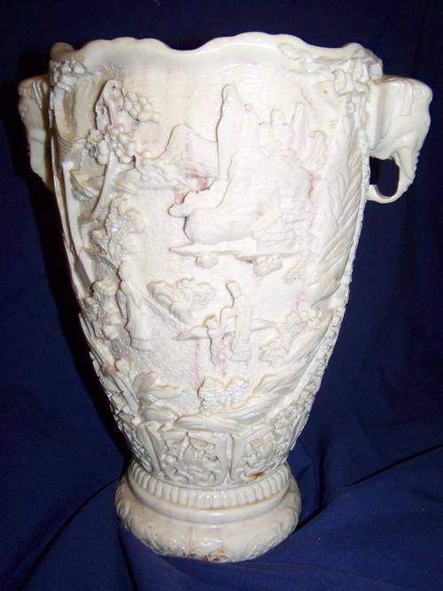 Oriental Porcelain Vintage FAUX IVORY ELEPHANT HEAD VASE was sold for