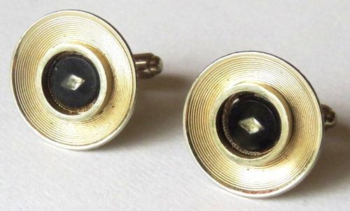 Vintage round gold tone and black cufflinks with small diamond-shaped stone