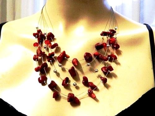 Red layered costume jewellery necklace with matching earrings