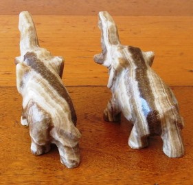 A pair of vintage hand carved marble onyx elephant figurines