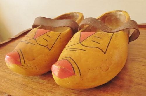 A very old pair of used Dutch clogs with leather straps