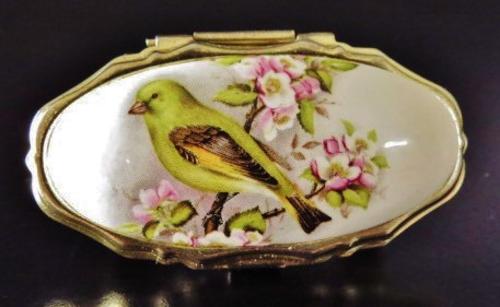 Vintage gold tone and porcelain mirrored lipstick holder decorated with a bird 
