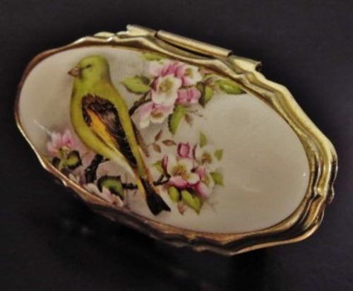 Vintage gold tone and porcelain mirrored lipstick holder decorated with a bird 