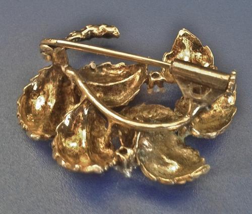 Vintage gold plated wreath brooch pin with three clear stones (signed/marked)
