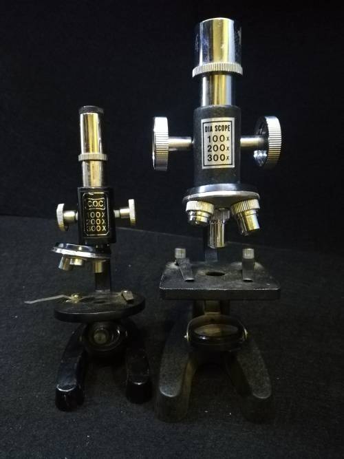 Microscopes Two microscopes made in Japan. Bigger one is Metal and