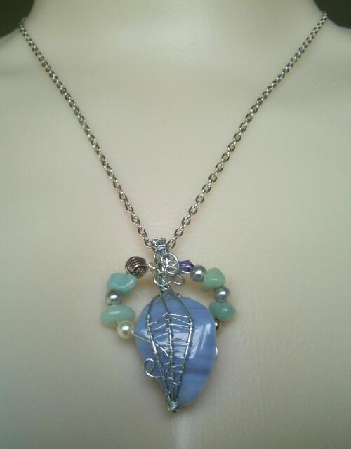 Blue lace agate pendant with Amazonite detailed trim in fine wire weaving by Fern