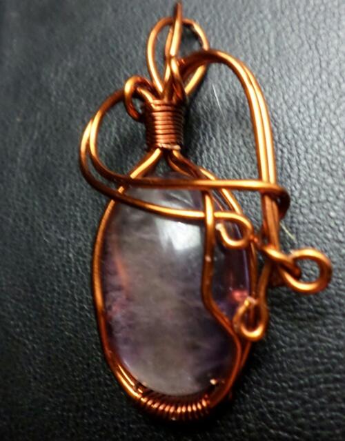 Amethyst pendant set in copper weave, hand made