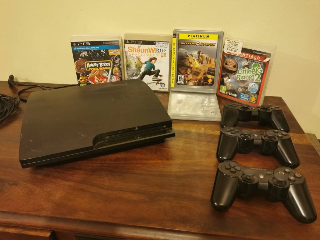 PlayStation Sony PlayStation 3 Console with 3 Remotes and a Few Games
