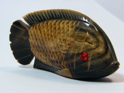 Beautiful fish figurine carved from horn with red stone eyes
