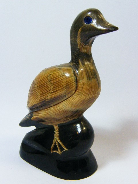 Beautiful duck figurine carved from horn with blue stone eyes