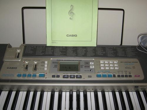 Electronic - Casio LK-215 keyboard including stand was sold for R1,650.